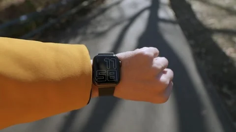 A stylish smartwatch is showcased on a bright path, highlighting its features Vidéo 295072268