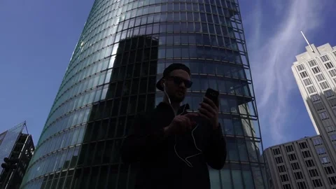 Stylish Smiling Man Having Online Video Chat On Smartphone in Berlin, Germany 動画素材 89356067