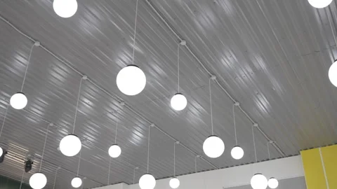 Stylish spherical ceiling lamps brighten spacious hall Видео 314884170
