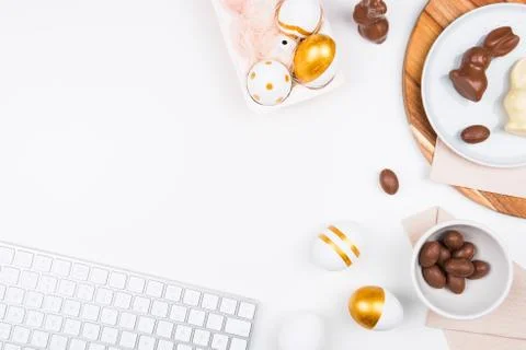 Stylish stationery background with chocolate easter eggs. Stock-Fotos