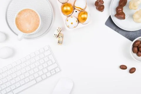 Stylish stationery background with chocolate easter eggs. Stock Photos