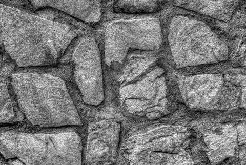 Stylish stone wall background in black and white Foto stock