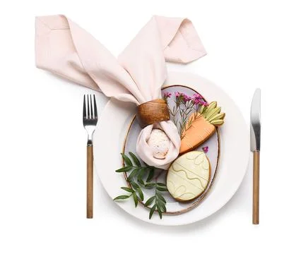 Stylish table setting with sweet cookies, Easter egg and beautiful flowers on Stock Photos
