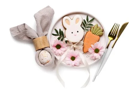 Stylish table setting with sweet cookies, Easter egg and beautiful flowers on Stock Photos