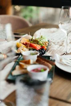 A stylish table setup with gourmet appetizers and elegant finger foods, perfect Stock Photos
