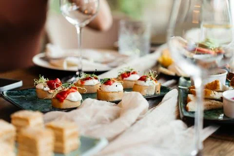 A stylish table setup with gourmet appetizers and elegant finger foods, perfect Stock Photos