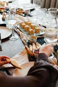 A stylish table setup with gourmet appetizers and elegant finger foods, perfect Stock Photos