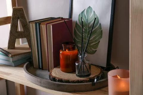 Stylish tray with different interior elements on wooden shelf Stock Photos