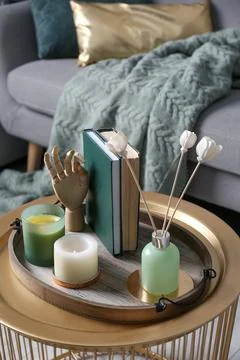 Stylish tray with different interior elements on table in living room Stock Photos