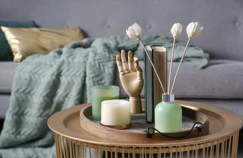 Stylish tray with different interior elements on table in living room Stock Photos