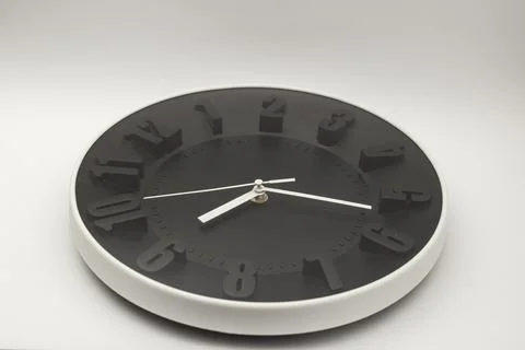 Stylish wall clock on white background Stock Photos