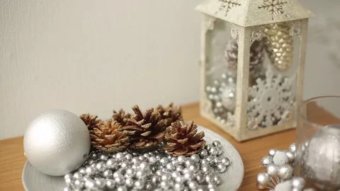 Stylish white christmas interior with decorations: bumps, beads, lantern, lamp Stock Footage 81384764