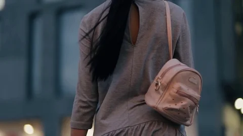 Stylish woman with bag in a night street Stock Footage