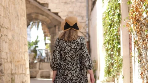 Stylish woman in hat posing elegantly in vintage setting Stock Footage 303848639
