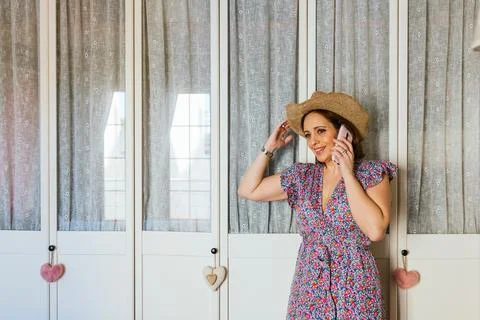 Stylish woman smiling while talking on the phone. Foto stock
