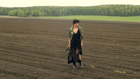 Stylish woman walking on field Stock Footage