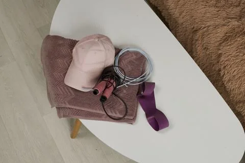 Stylish workout essentials on a cozy white table with soft textures Stock Photos