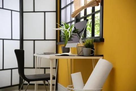 Stylish workplace with computer near window at home office Stock Photos