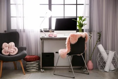 Stylish workplace with computer near window at home office. Space for text Stock Photos