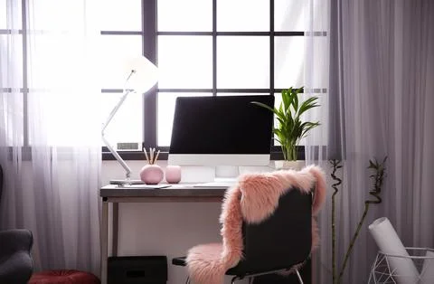 Stylish workplace with computer near window at home office. Space for text Stock-Fotos