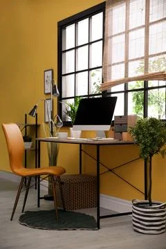 Stylish workplace with computer near window at home office. Space for text Stock-Fotos