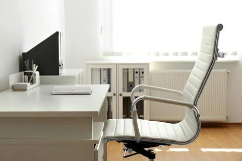 Interior of modern office with chairs at desk stock photo