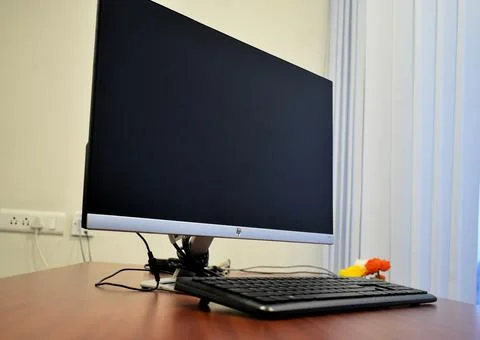 Stylish workspace with desktop computer, office supplies, houseplant and book Foto stock