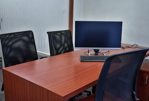 Stylish workspace with desktop computer, office supplies, houseplant and book Stock Photos