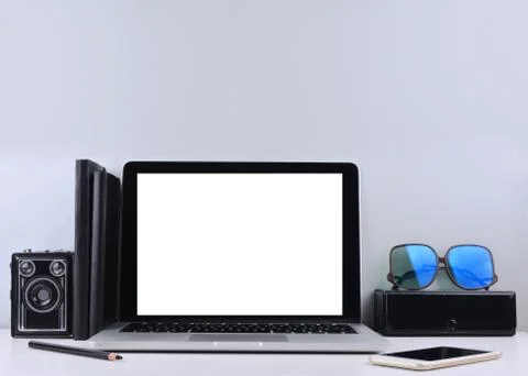 Stylish workspace with laptop computer, office supplies. Stock Photos