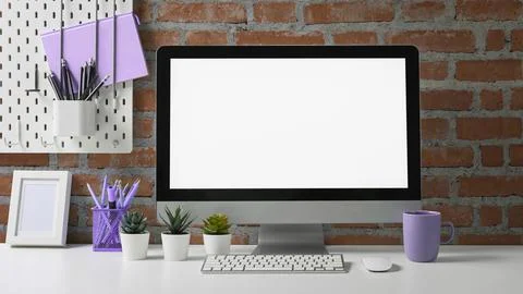 Stylish workspace with mock up computer and office supplies on white table Stock Photos