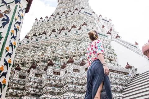 Stylish Young european tourist at Wat Arun, Bangkok low angle view Stock Photos
