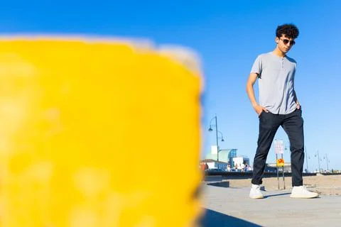 Stylish young influencer boy posing in modern casual wear with a great copy s Stock Photos