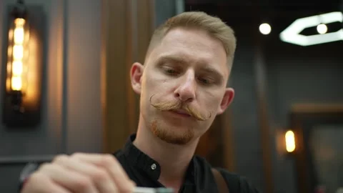 Stylish young man with a mustache Stock Footage 245423462