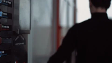 Stylish Young man push a button on a self-service car wash and start clean Stock Footage 144674031