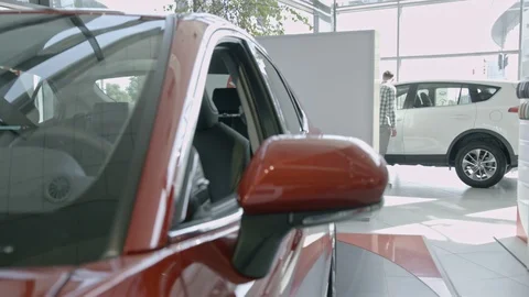 Stylish young man sitting inside car from driver's side. Video stock 99773173