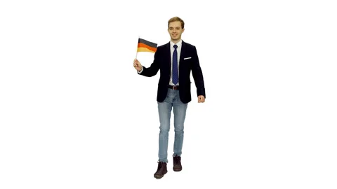 Stylish young man in suit jacket walks with waving flag of Deutschland, alpha in Video stock 123152698