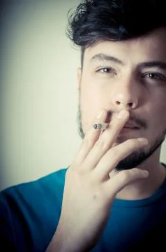Stylish young modern man with cigarette Stock-Fotos
