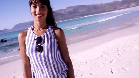 Stylish young woman on the beach Stock Footage