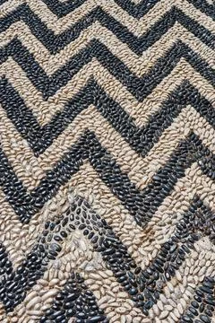 Stylish zigzag road pattern made with pebbles for design Stock Photos