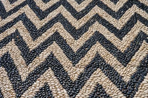 Stylish zigzag road pattern made with pebbles for design Stock Photos