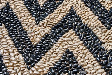 Stylish zigzag road pattern made with pebbles for design Stock Photos