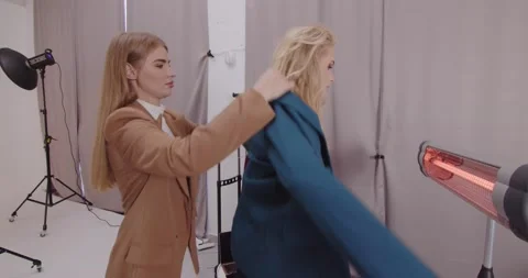 Stylist Creates A New Image For The Model In The Studio Video stock 235317666