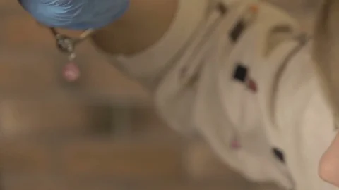 Stylist does beautiful eyebrows to the young beautiful woman. Beauty shop. Close 스톡 동영상 73945152