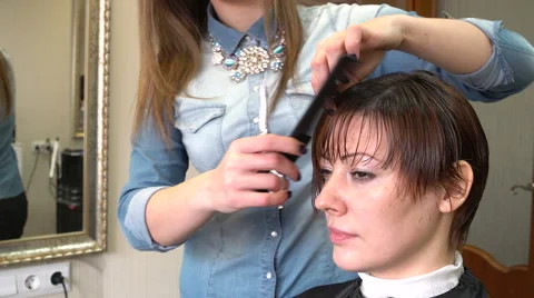 The stylist mows bang Stock Footage 62299671