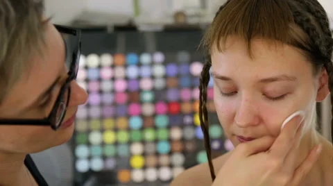 Stylist prepares the skin for make-up Stock Footage 68648729