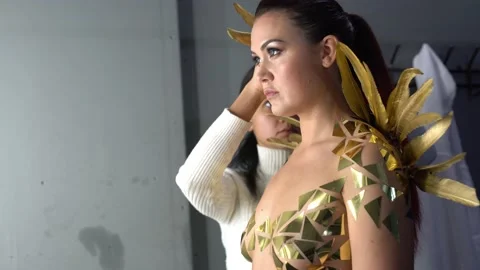 Stylist preparing model for photo shoot in studio Video stock 145177343