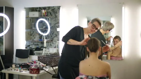 The stylist works in the reflection of the mirror Stock Footage 68648503