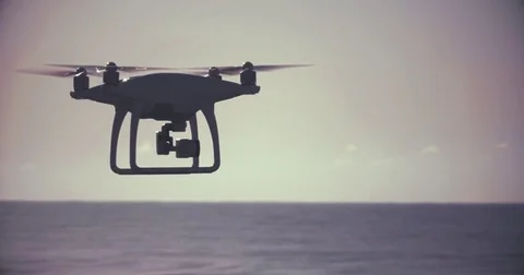 Stylized Backlit Drone Flies Near Beach Vidéo 75657340