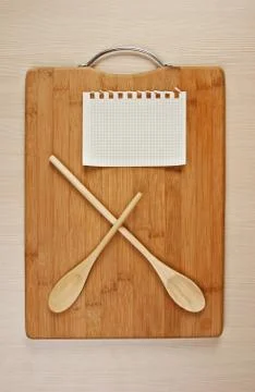 Stylized clock - cutting board and wooden spoons Stock Photos