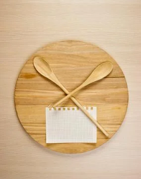 Stylized clock - cutting board and wooden spoons Stock Photos